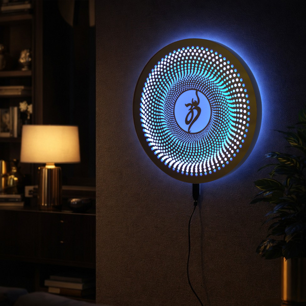 Decorative wall light with a circular design and blue glow on a dark wall.